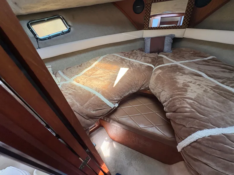 Slide: The Image of 1988 Carver 36 Aft Cabin interior with cozy bed and soft brown bedding. - 30