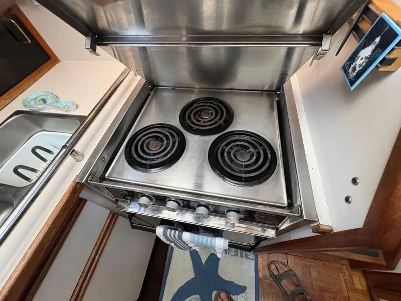Slide: The Image of Stainless steel stove in 1988 Carver 36 Aft Cabin kitchen area. - 42