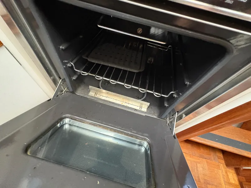 Slide: The Image of Open oven inside a 1988 Carver 36 Aft Cabin yacht kitchen. - 43