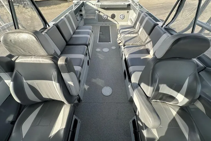 Slide: The Image of 2021 Hewescraft 240 Ocean Pro interior with spacious seating and modern design. - 6