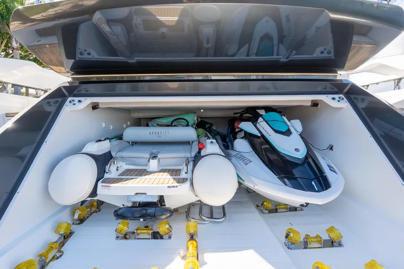 Slide: The Image of 2023 Azimut S8 yacht garage with jet ski and inflatable boat storage. - 11