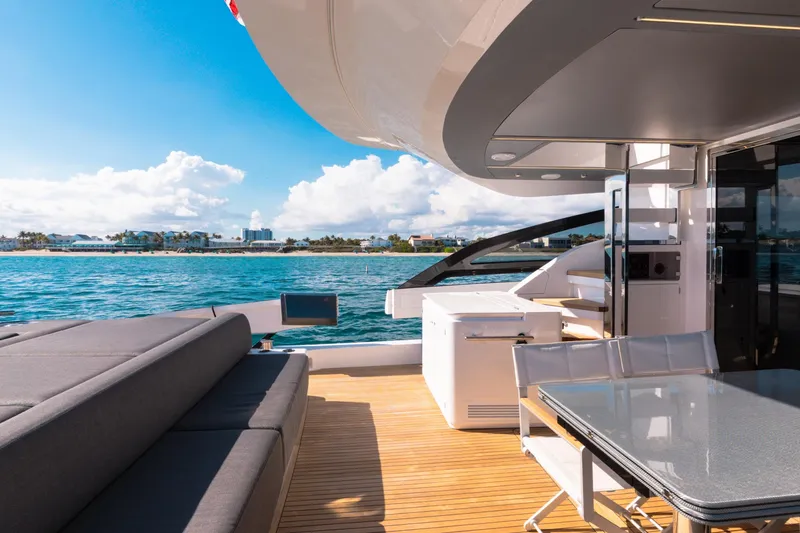 Slide: The Image of Luxurious 2023 Azimut S8 yacht deck with seating, table, and ocean view. - 15