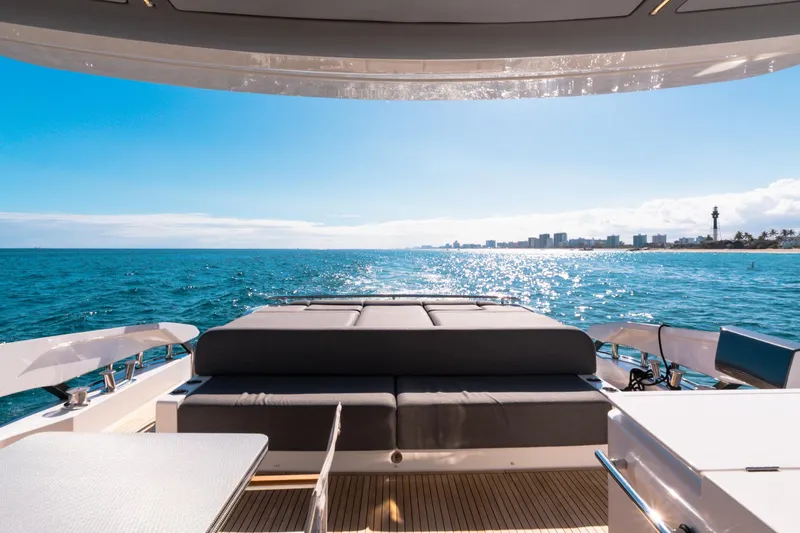 Slide: The Image of 2023 Azimut S8 yacht deck with ocean view and city skyline in the distance. - 18