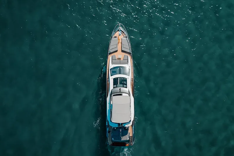 Slide: The Image of Aerial view of 2023 Azimut S8 yacht cruising on clear blue water. - 38