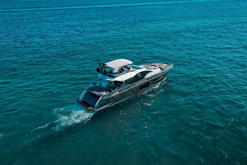 Slide: The Image of 2023 Azimut S8 yacht cruising on clear blue ocean waters. - 41