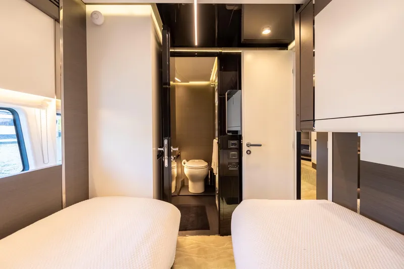 Slide: The Image of Luxurious interior of 2023 Azimut S8 yacht with twin beds and modern bathroom. - 48