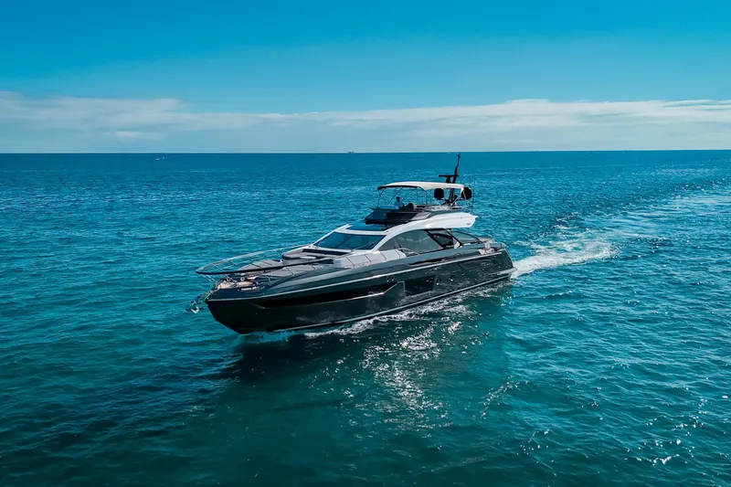Slide: The Image of 2023 Azimut S8 yacht cruising on open blue sea under clear sky. - 5