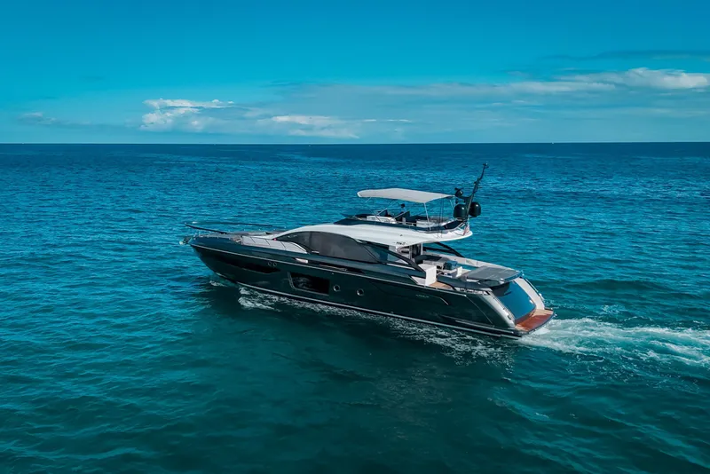 Slide: The Image of 2023 Azimut S8 yacht cruising on open blue sea under clear sky. - 6