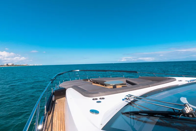 Slide: The Image of 2023 Azimut S8 yacht cruising on open sea under clear blue sky. - 62