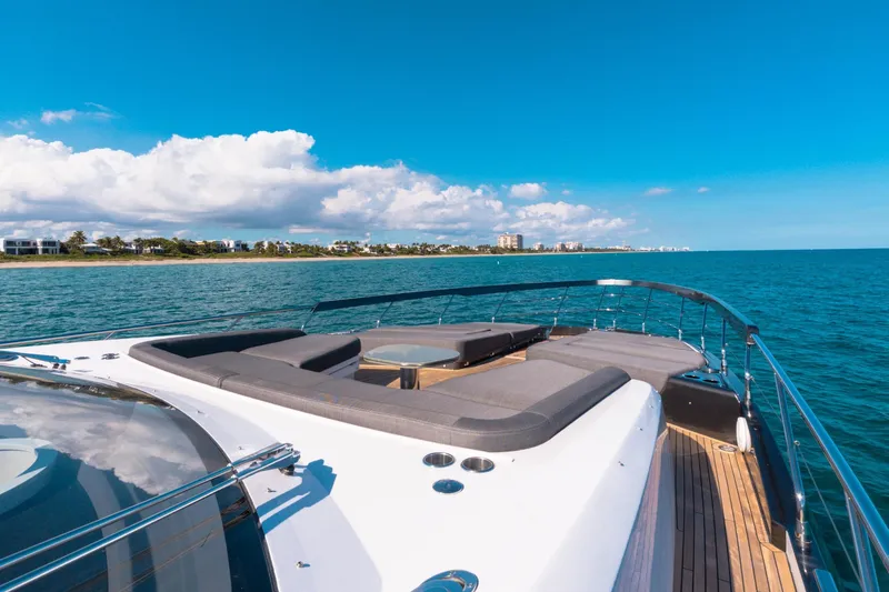 Slide: The Image of 2023 Azimut S8 yacht cruising on a sunny day with coastal view. - 63