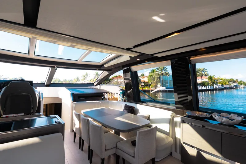 Slide: The Image of Luxurious interior of 2023 Azimut S8 yacht with panoramic windows and elegant dining area. - 67