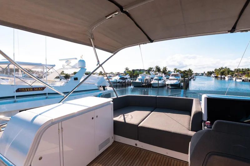 Slide: The Image of Luxurious 2023 Azimut S8 yacht interior with marina view, featuring sleek seating and modern design. - 75