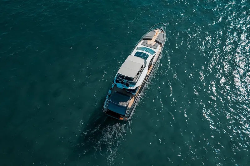 Slide: The Image of Aerial view of 2023 Azimut S8 yacht cruising on open water. - 78