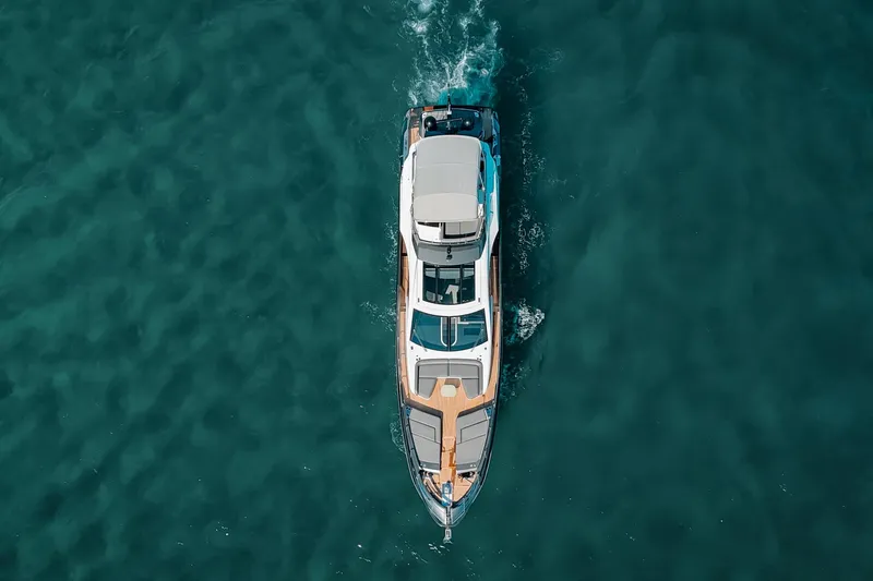 Slide: The Image of Aerial view of 2023 Azimut S8 yacht cruising on clear blue water. - 81