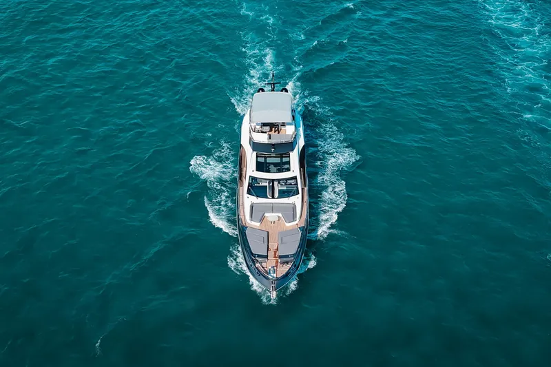 Slide: The Image of Aerial view of 2023 Azimut S8 yacht cruising on blue ocean waters. - 84
