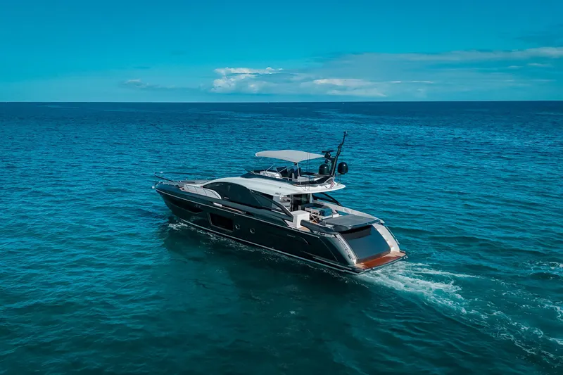 Slide: The Image of 2023 Azimut S8 yacht cruising on open blue sea under clear sky. - 85