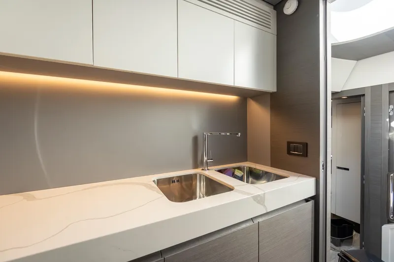 Slide: The Image of Modern kitchen interior of 2023 Azimut S8 yacht with sleek design and ambient lighting. - 86