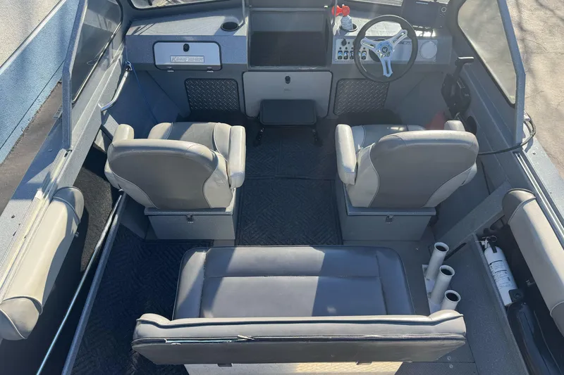 Slide: The Image of Interior of a 2018 KingFisher 1825 Falcon boat with seating and steering wheel. - 10