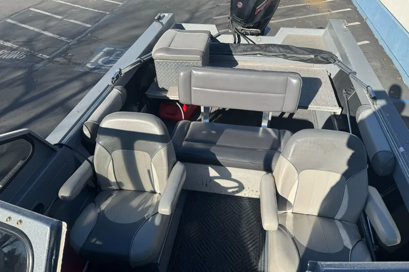 Slide: The Image of Interior of 2018 KingFisher 1825 Falcon boat with seating and motor view. - 12