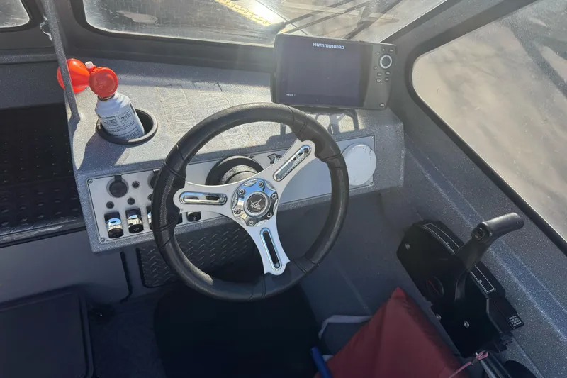 Slide: The Image of Steering console of a 2018 KingFisher 1825 Falcon boat with navigation equipment. - 15