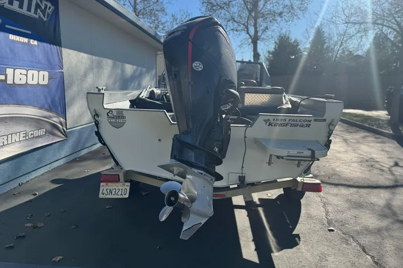 Slide: The Image of 2018 KingFisher 1825 Falcon boat with outboard motor in sunny driveway. - 3