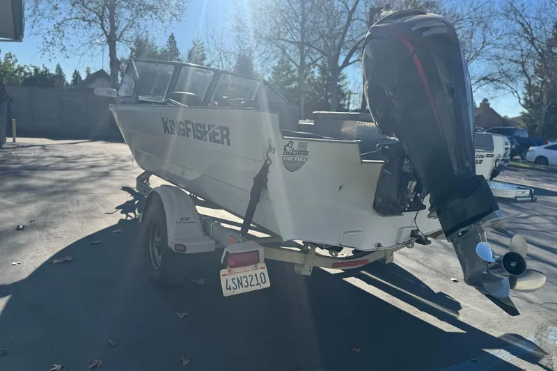 Slide: The Image of 2018 KingFisher 1825 Falcon boat on trailer, parked outdoors in sunlight. - 4