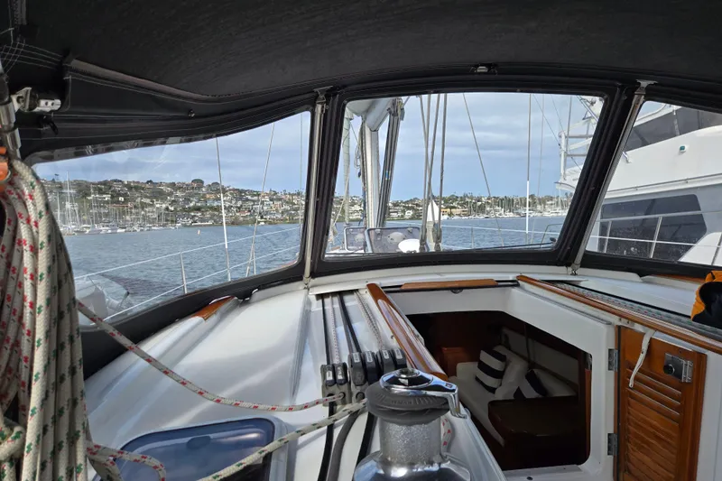 Slide: The Image of 2008 Beneteau Oceanis 49 sailboat cockpit view with marina in the background. - 19