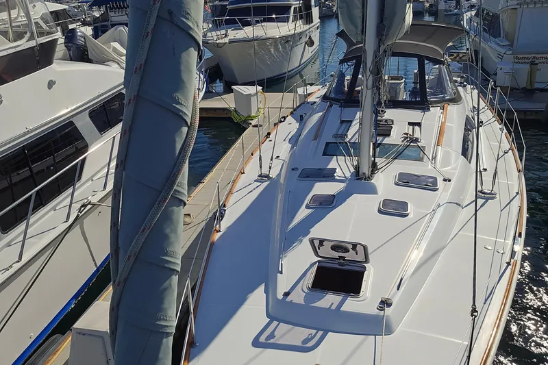 Slide: The Image of 2008 Beneteau Oceanis 49 sailboat docked at marina, showcasing deck and rigging. - 20