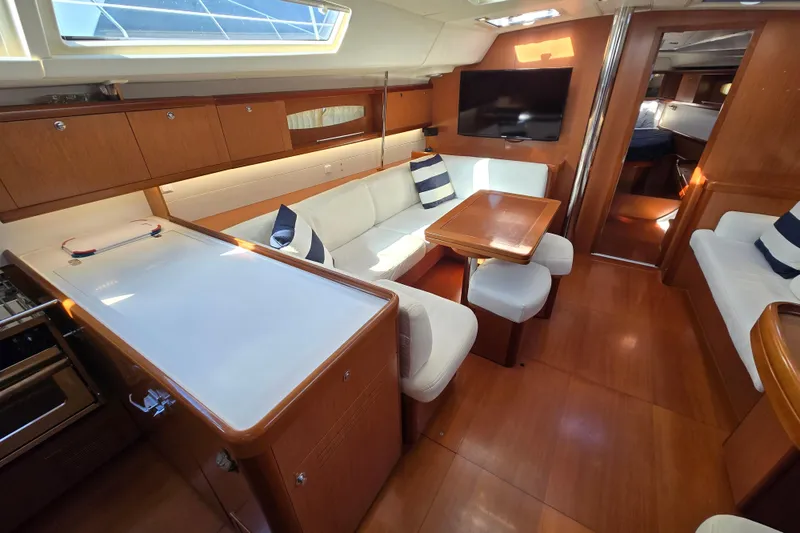 Slide: The Image of Luxurious interior of 2008 Beneteau Oceanis 49 yacht with elegant wood finish and seating. - 22