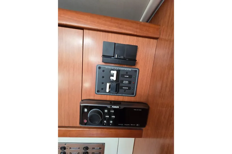 Slide: The Image of Control panel on 2008 Beneteau Oceanis 49 yacht, featuring power and audio systems. - 39