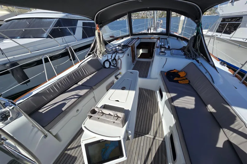 Slide: The Image of 2008 Beneteau Oceanis 49 yacht cockpit with seating, navigation equipment, and shaded canopy. - 4