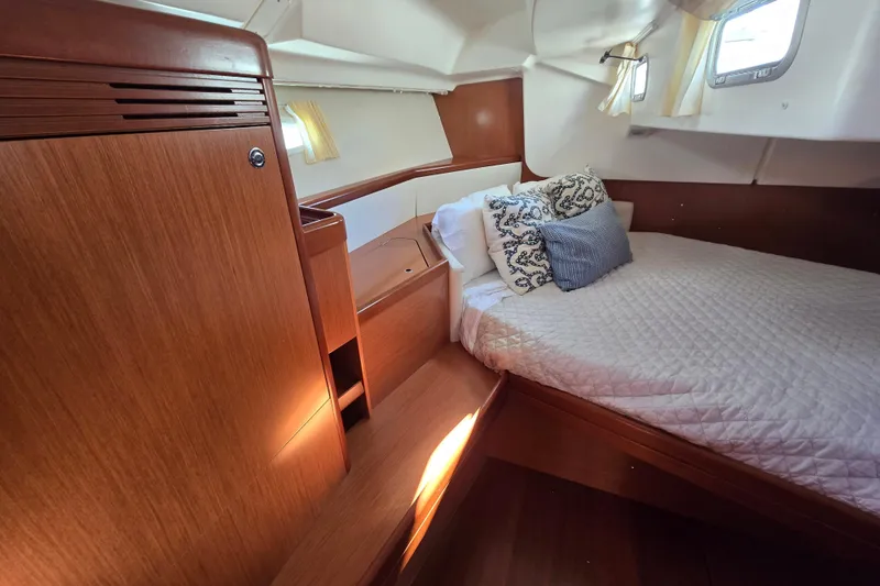 Slide: The Image of Cozy cabin interior of 2008 Beneteau Oceanis 49 sailboat with wooden finish and comfortable bedding. - 43