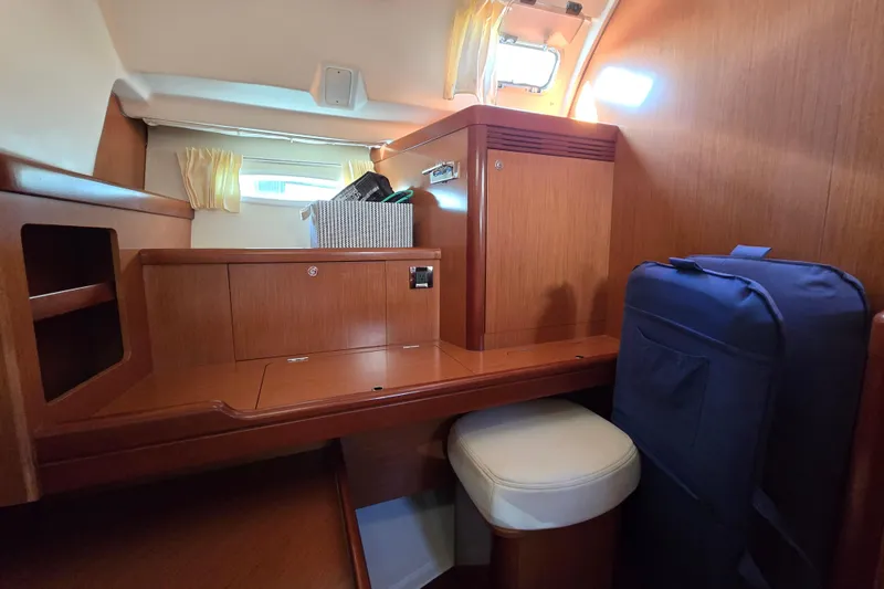 Slide: The Image of Interior of 2008 Beneteau Oceanis 49 yacht with wooden cabinetry and seating. - 45