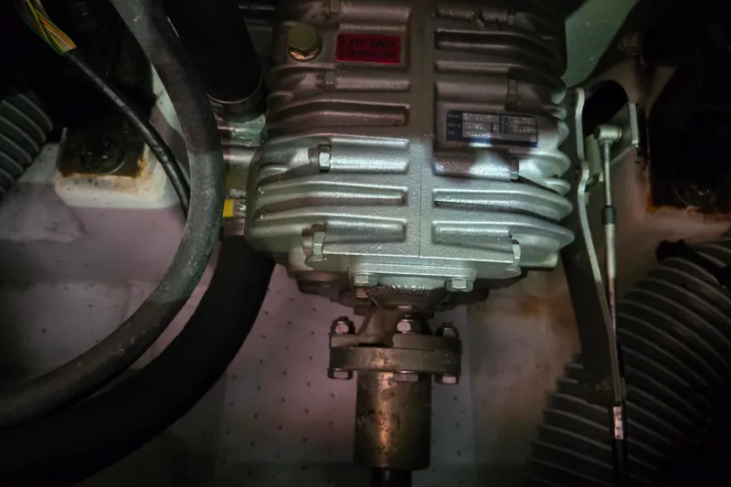 Slide: The Image of Engine compartment of a 2008 Beneteau Oceanis 49 sailboat, showing mechanical components. - 47