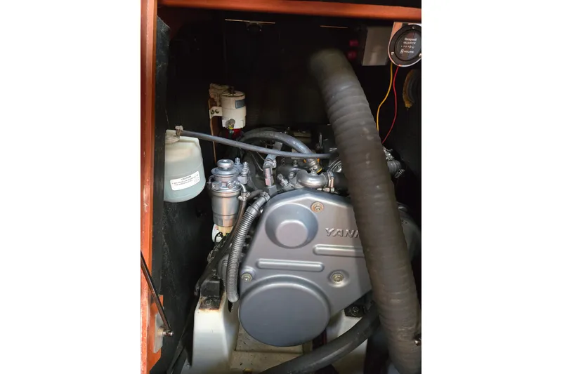 Slide: The Image of Engine compartment of a 2008 Beneteau Oceanis 49 sailboat, featuring a Yanmar engine. - 49