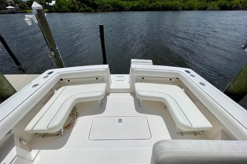 Slide: The Image of 2003 Tiara Yachts 2900 Coronet boat deck with white seating and water view. - 3