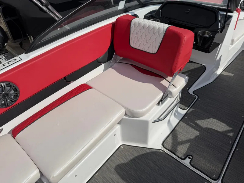 Slide: The Image of Interior of a 2022 Glastron 210 GX with red and white seating. - 10