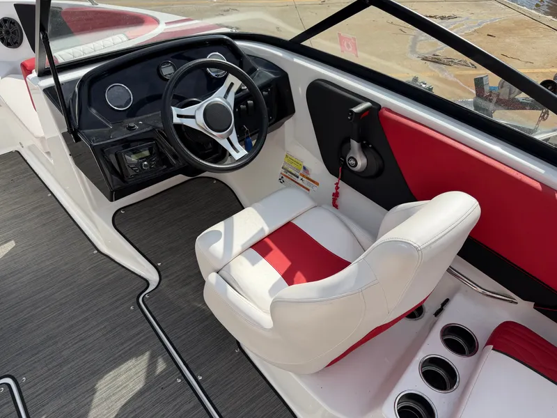 Slide: The Image of Interior of a 2022 Glastron 210 GX boat with red and white seating. - 11