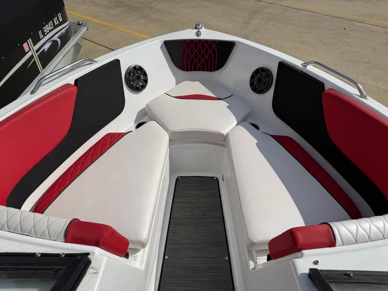 Slide: The Image of Interior of a 2022 Glastron 210 GX boat with red and black seating. - 17