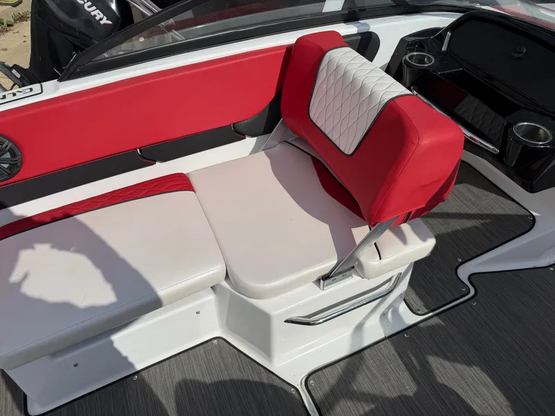 Slide: The Image of Interior of a 2022 Glastron 210 GX boat with red and white seating. - 18