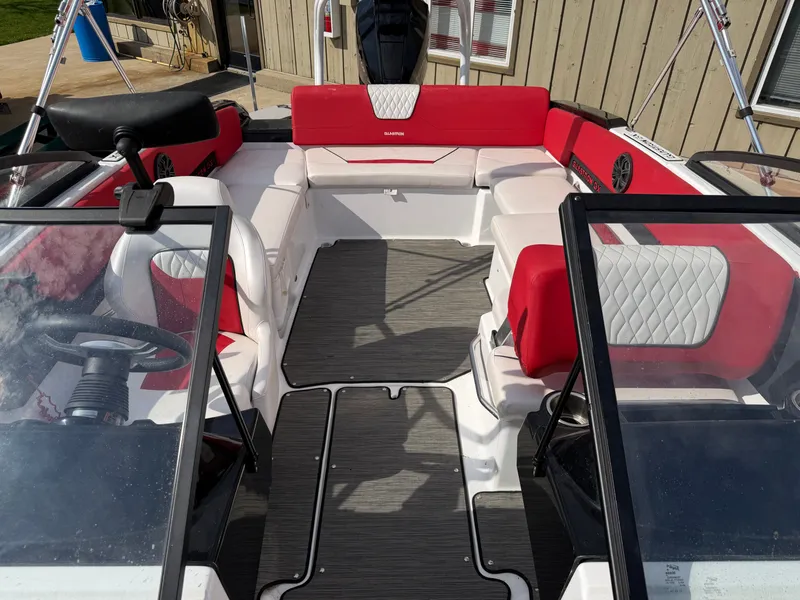 Slide: The Image of Interior of a 2022 Glastron 210 GX boat with red and white seating. - 20