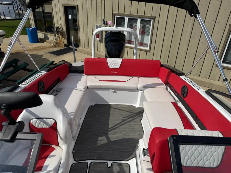Slide: The Image of Interior of a 2022 Glastron 210 GX boat with red and white seating. - 21