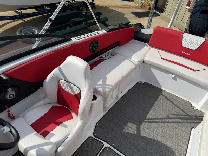 Slide: The Image of 2022 Glastron 210 GX boat interior with red and white seating. - 24