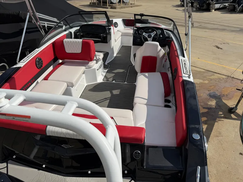 Slide: The Image of Interior view of a 2022 Glastron 210 GX boat with red and white seating. - 6
