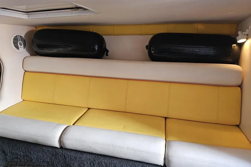 Slide: The Image of Interior of 2007 Donzi 38 ZR boat with yellow and white seating. - 102