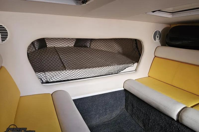 Slide: The Image of Interior of 2007 Donzi 38 ZR boat with yellow seating and sleeping area. - 103