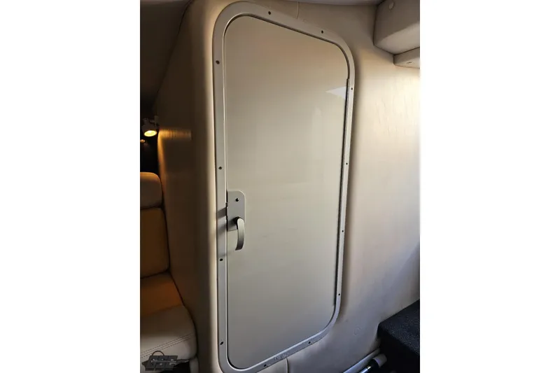 Slide: The Image of 2007 Donzi 38 ZR cabin door interior with sleek design and modern handle. - 104