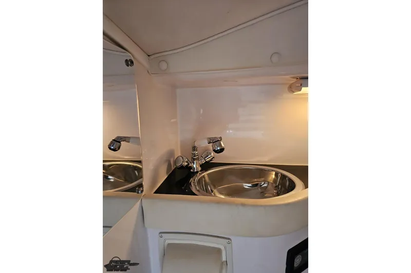 Slide: The Image of 2007 Donzi 38 ZR boat interior with sleek sink and faucet. - 106