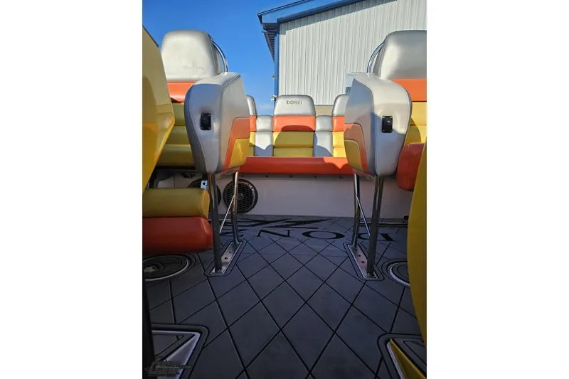 Slide: The Image of 2007 Donzi 38 ZR boat interior with colorful seating and sleek design. - 110