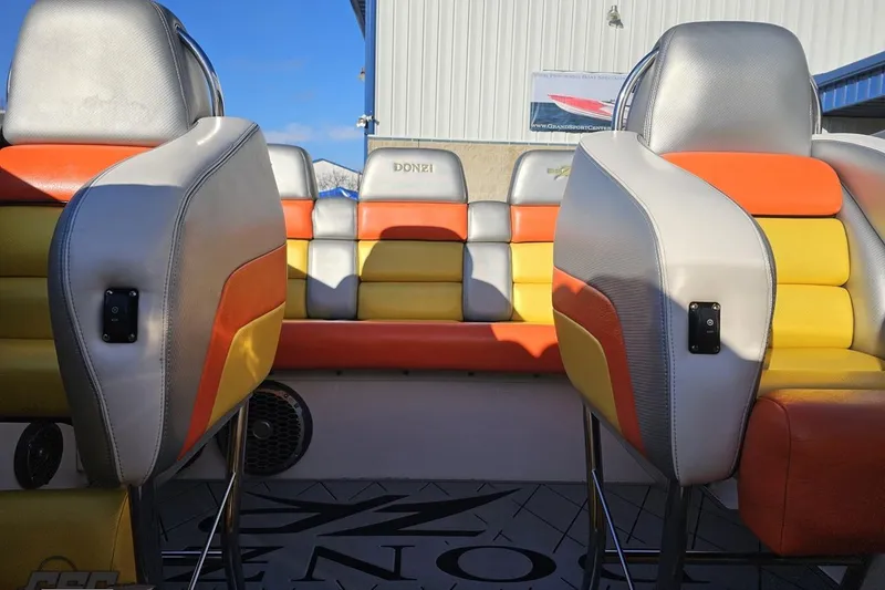 Slide: The Image of 2007 Donzi 38 ZR boat interior with colorful seating and modern design. - 111